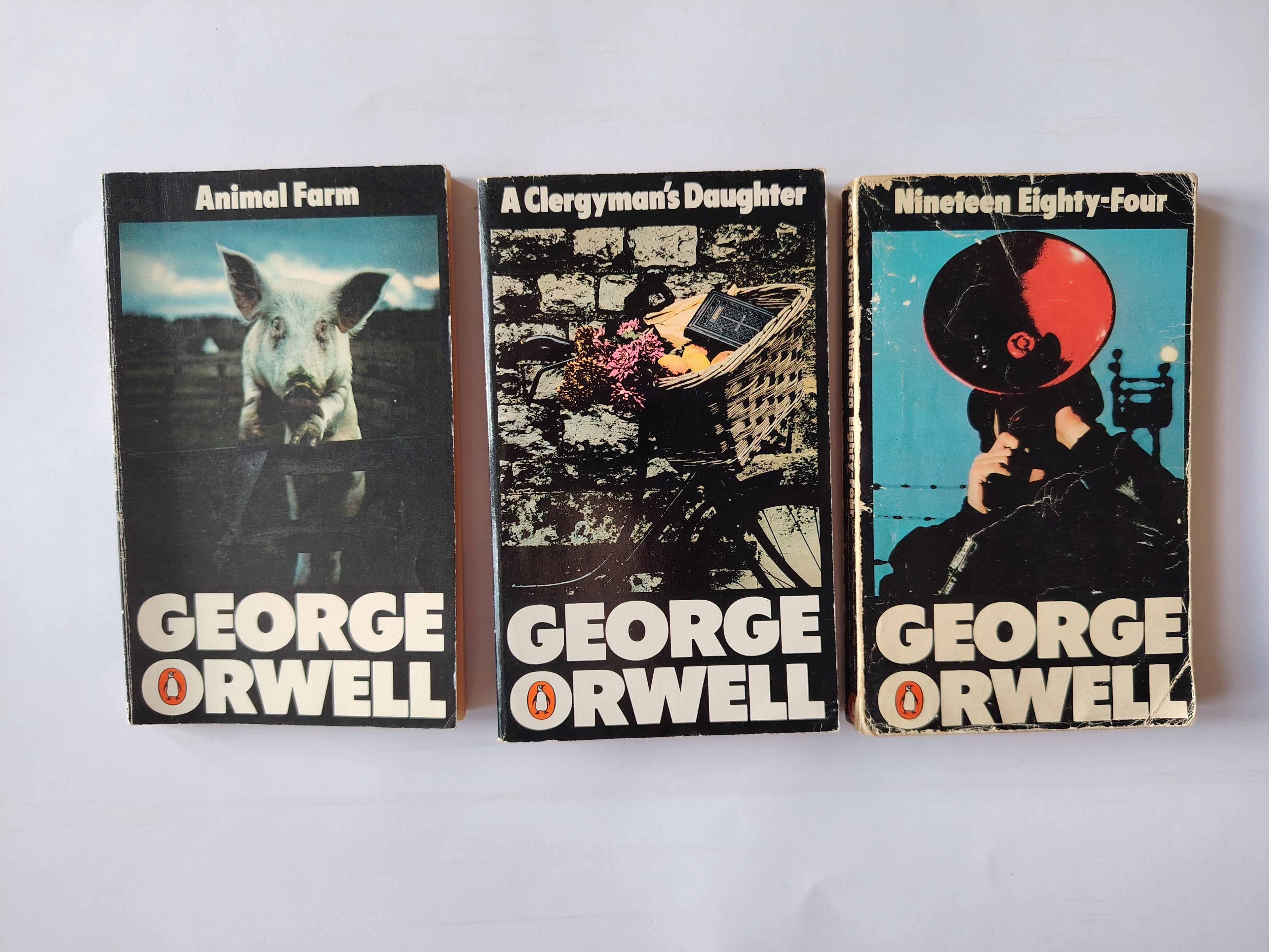 George Orwell Penguin Paperbacks Nineteen Eighty-Four, Animal Farm, A Clergyman's Daughter Humphrey Sutton Covers